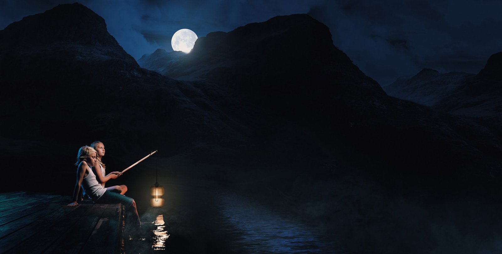 Two people on a dock at night under a full moon.